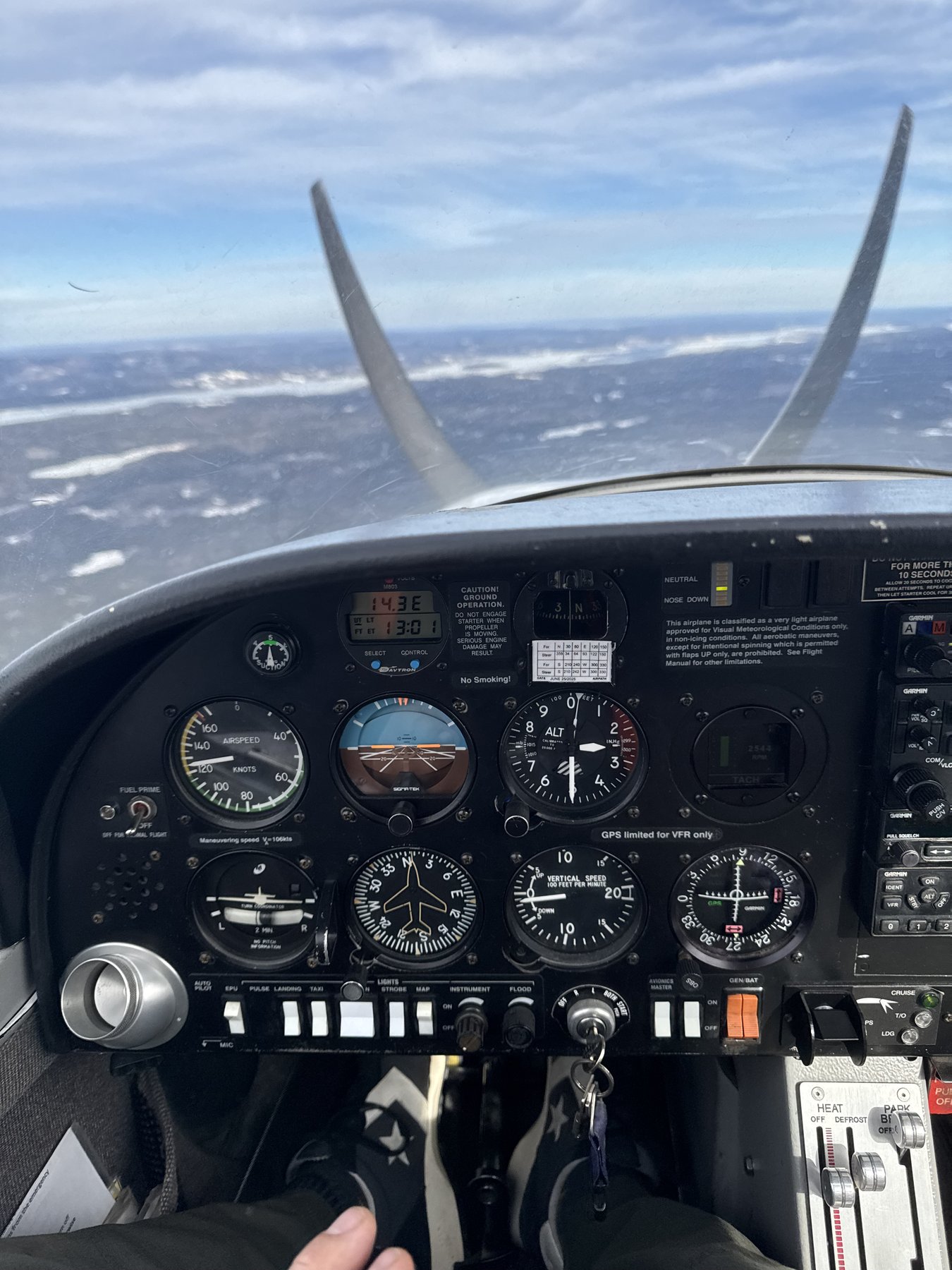 In-flight cockpit view from a Canadian-registered fixed-wing aircraft during an air ferry flight with Freddy Tow Co.'s commercially qualified pilot.